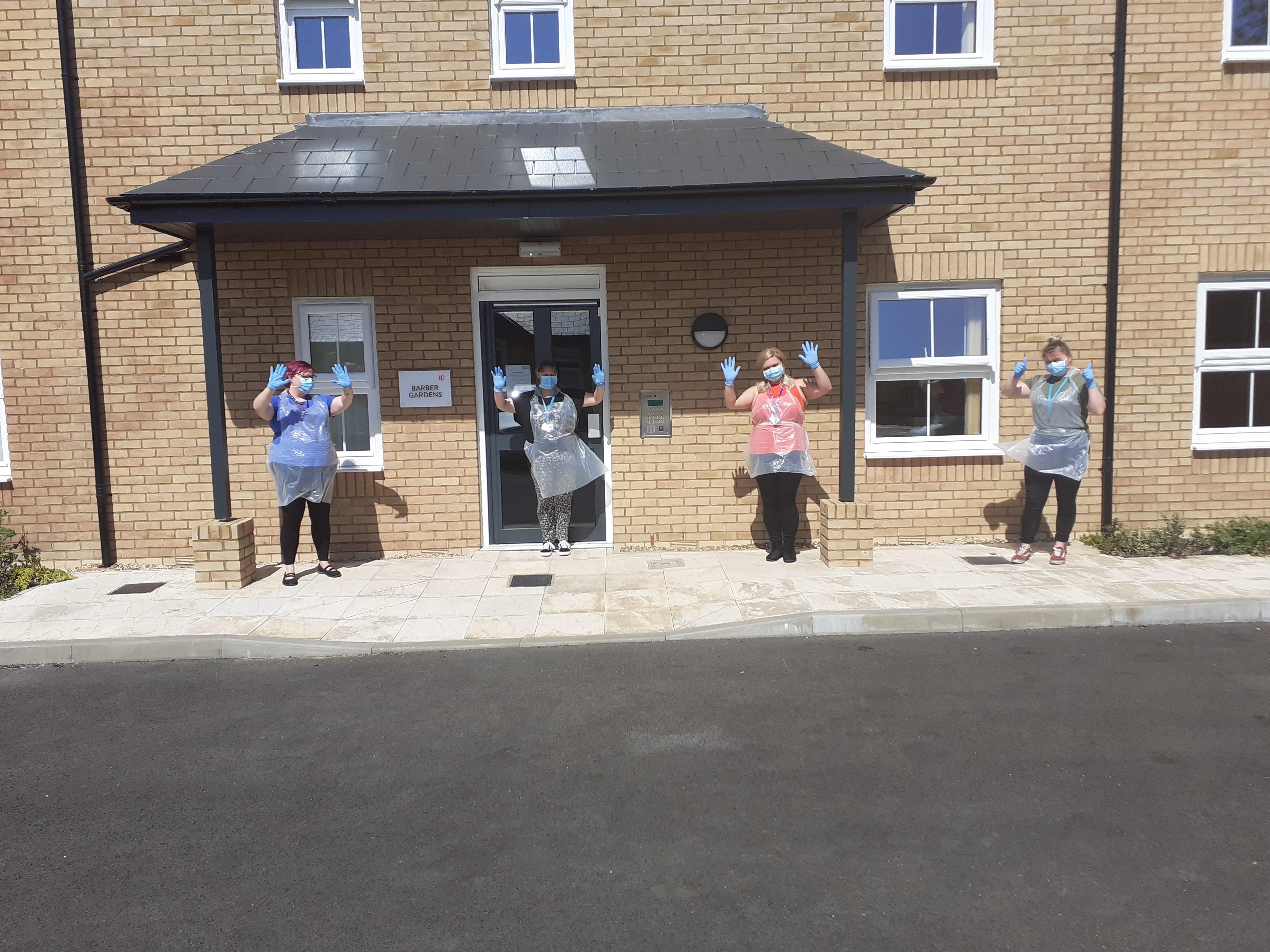 Staff outside the service wearing PPR