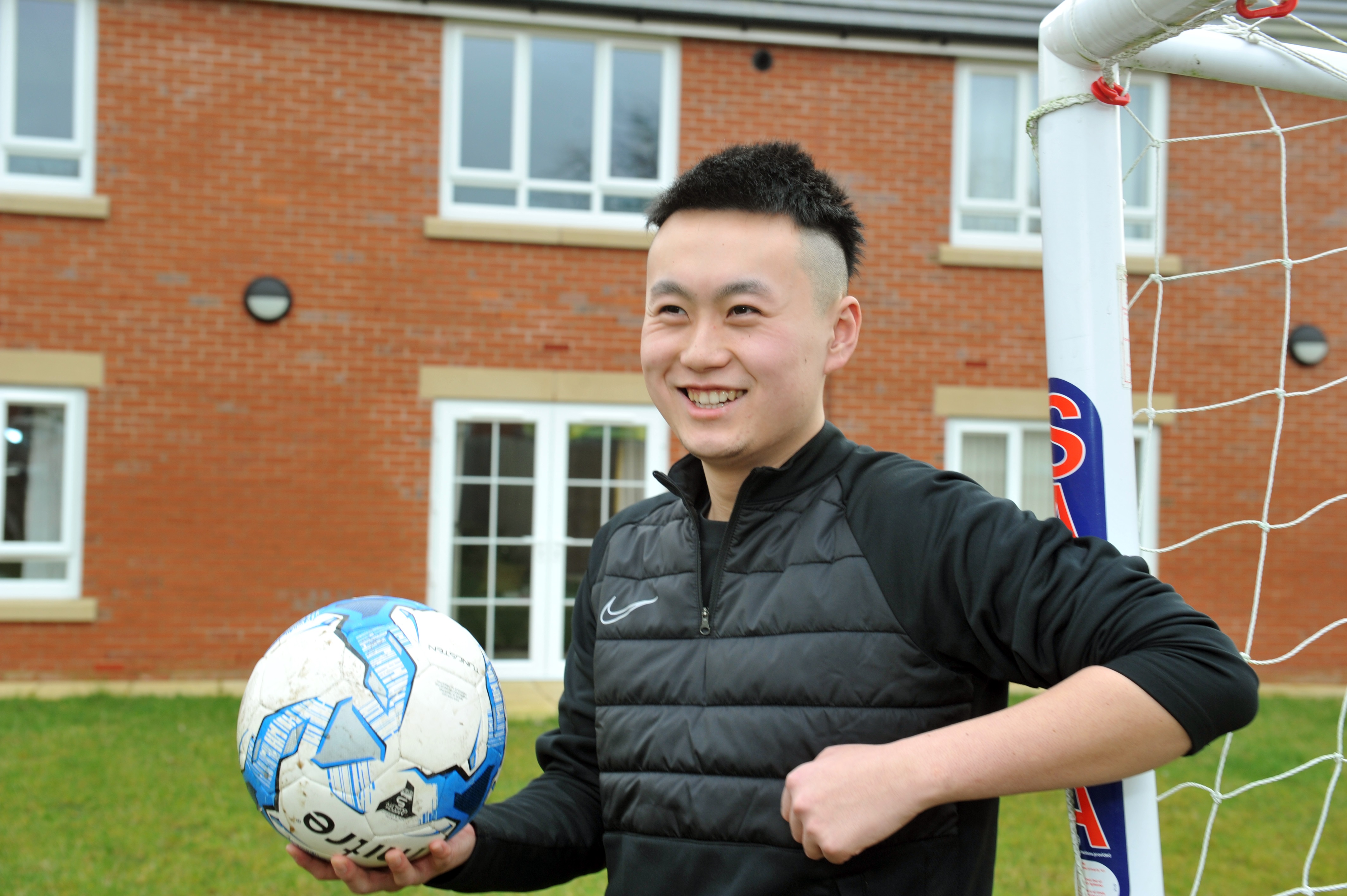 Young man holding football