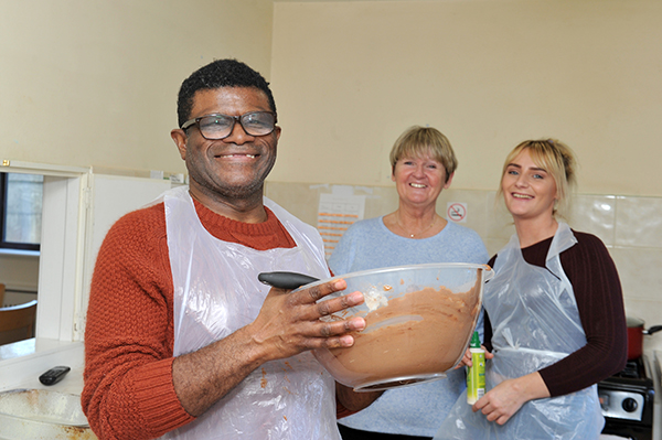 smiling people cooking