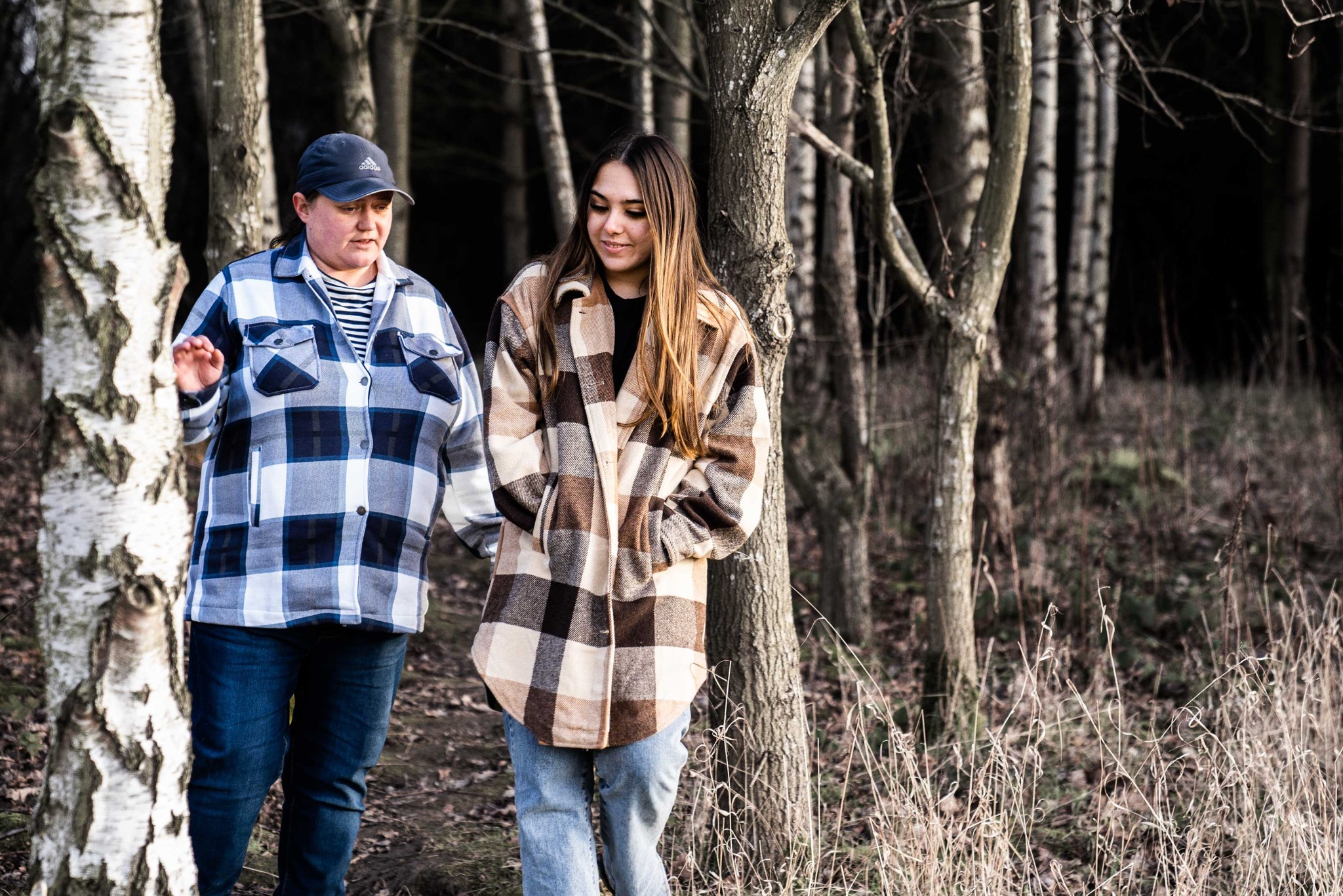 Ladies talking while walking in the woods