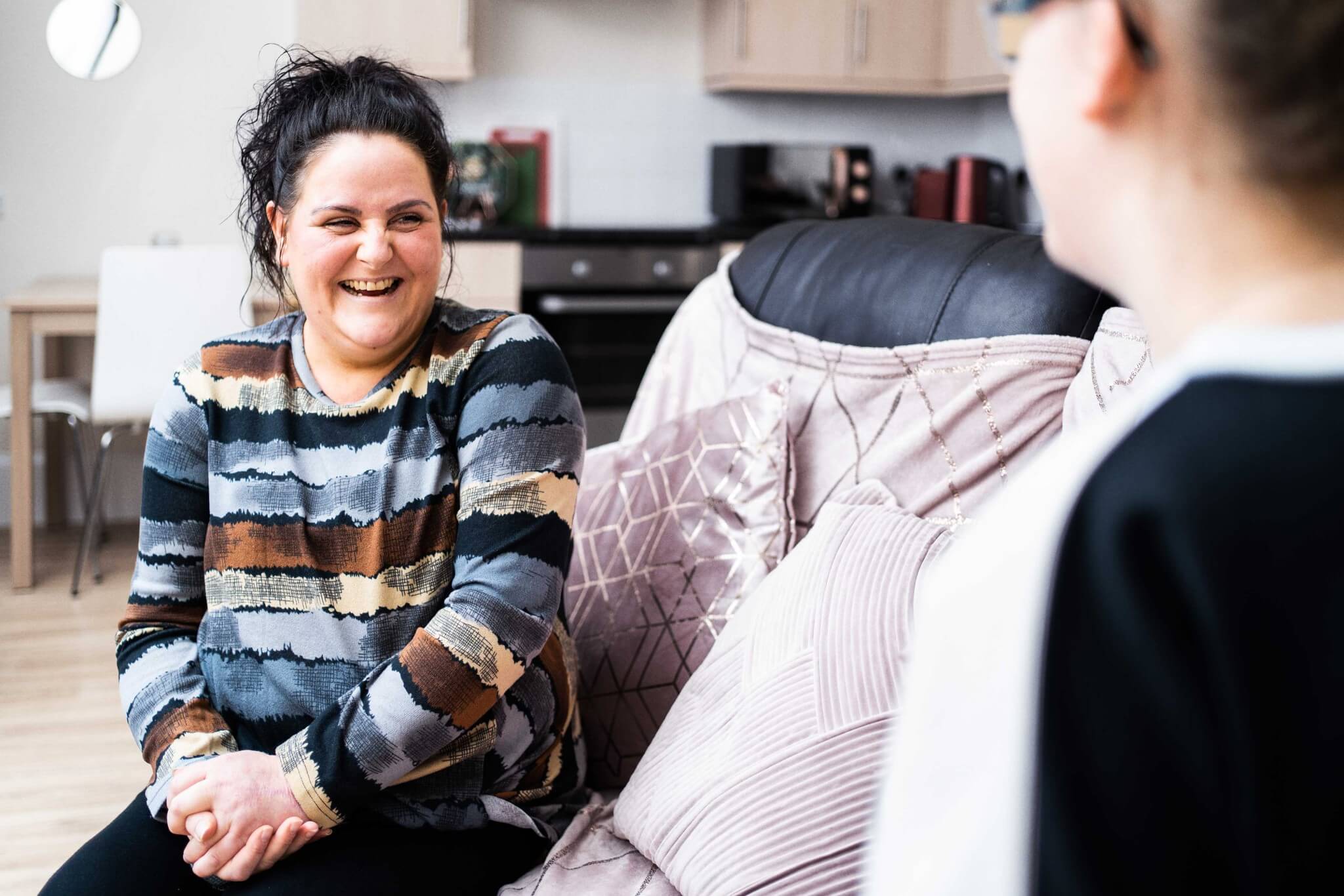 Lady laughing with support worker