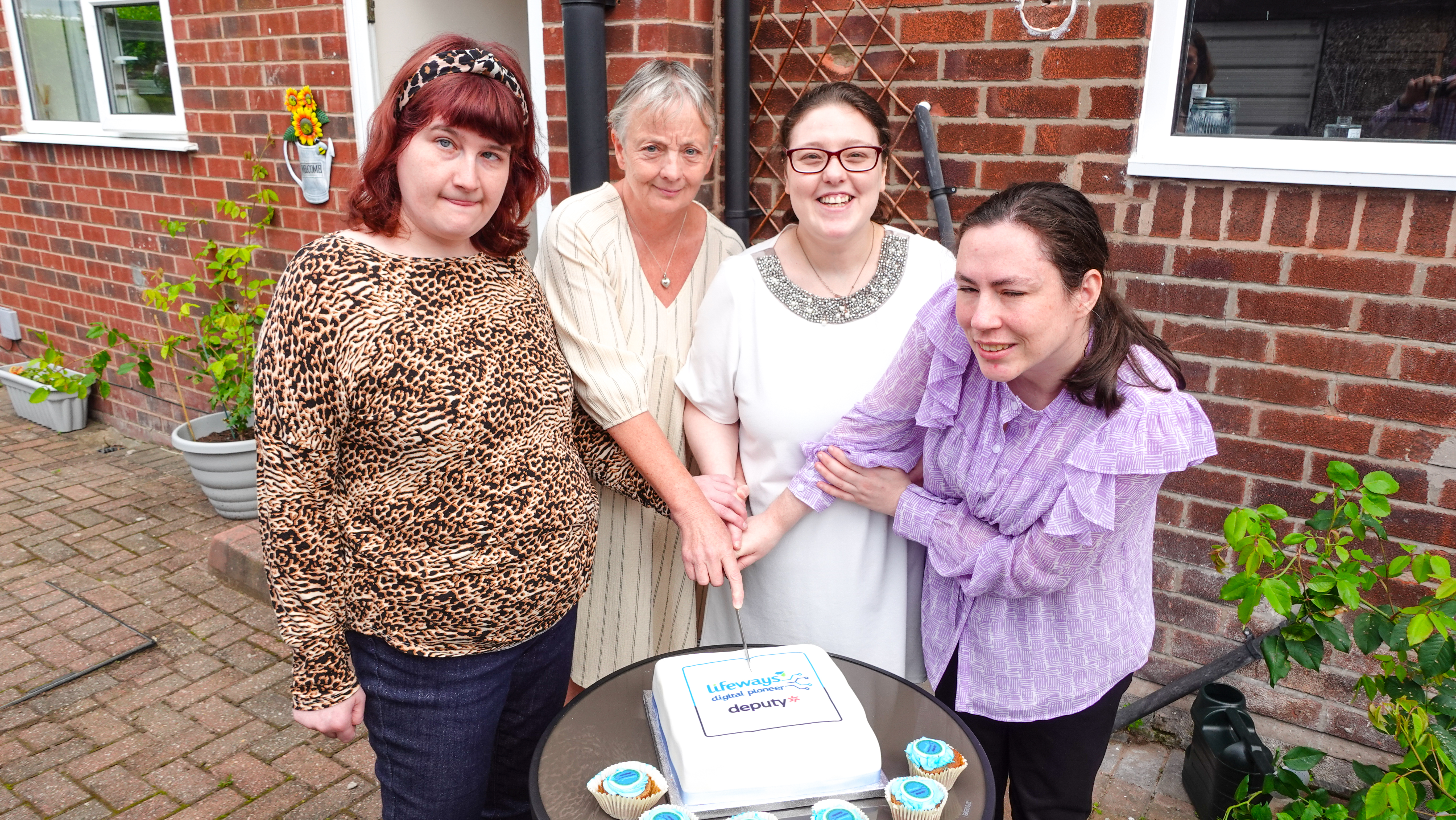 A group of peop[le we support and Lifeways Team Members celebrate the launch of Deputy