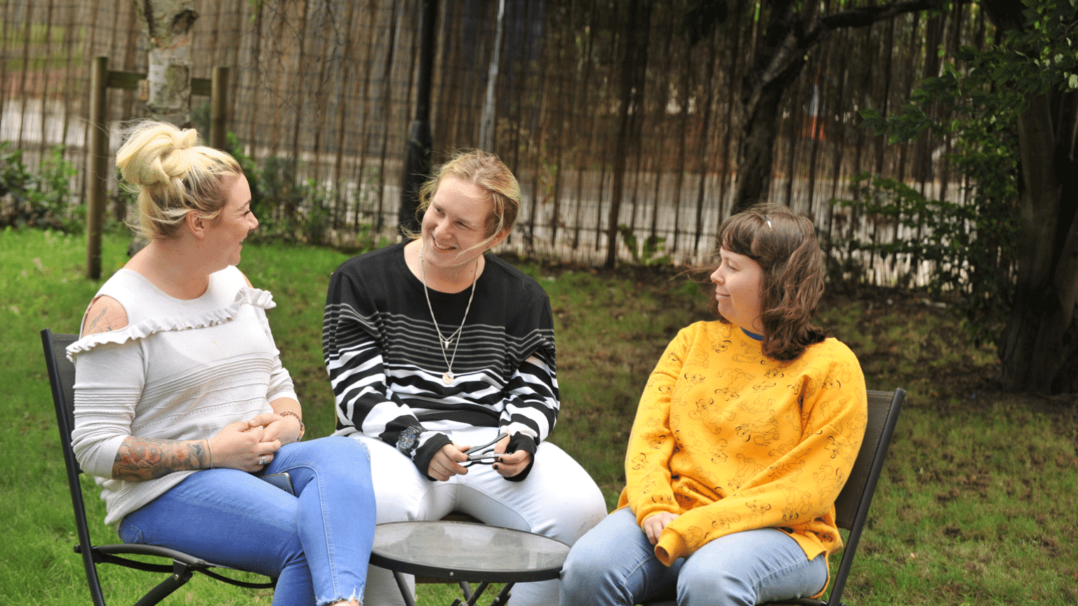 Friends sat in the garden