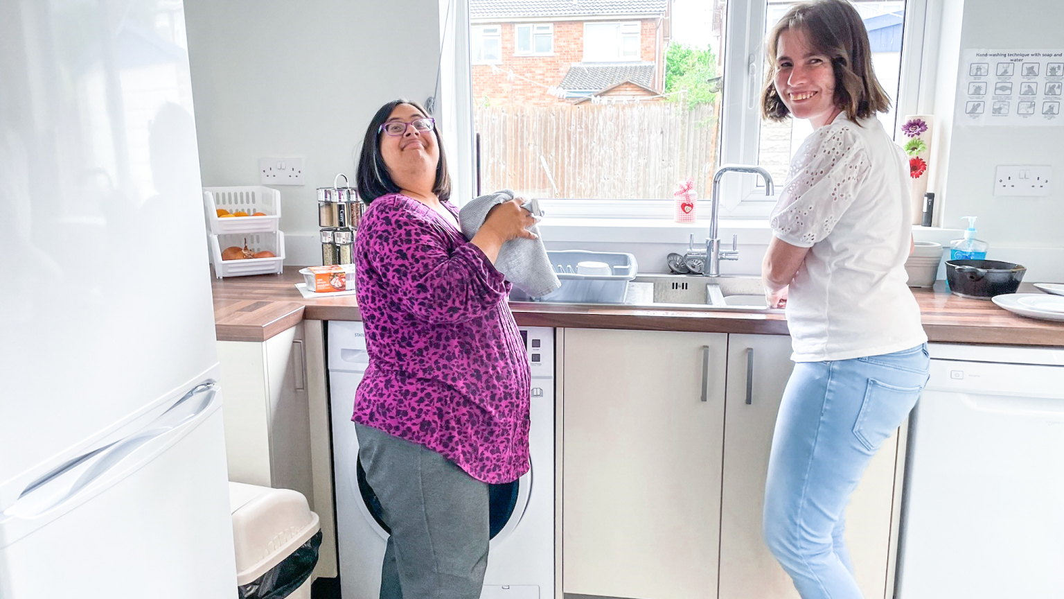 Best friends washing up
