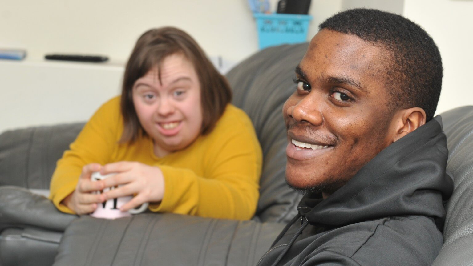 smiling support worker with a person we support