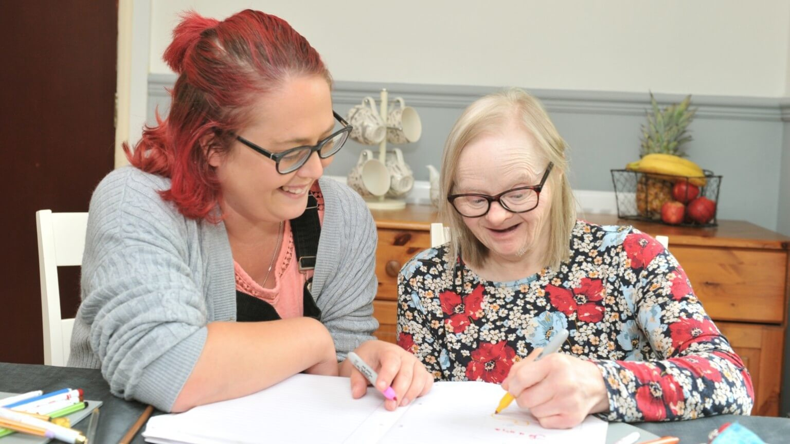 Two ladies doing a craft together