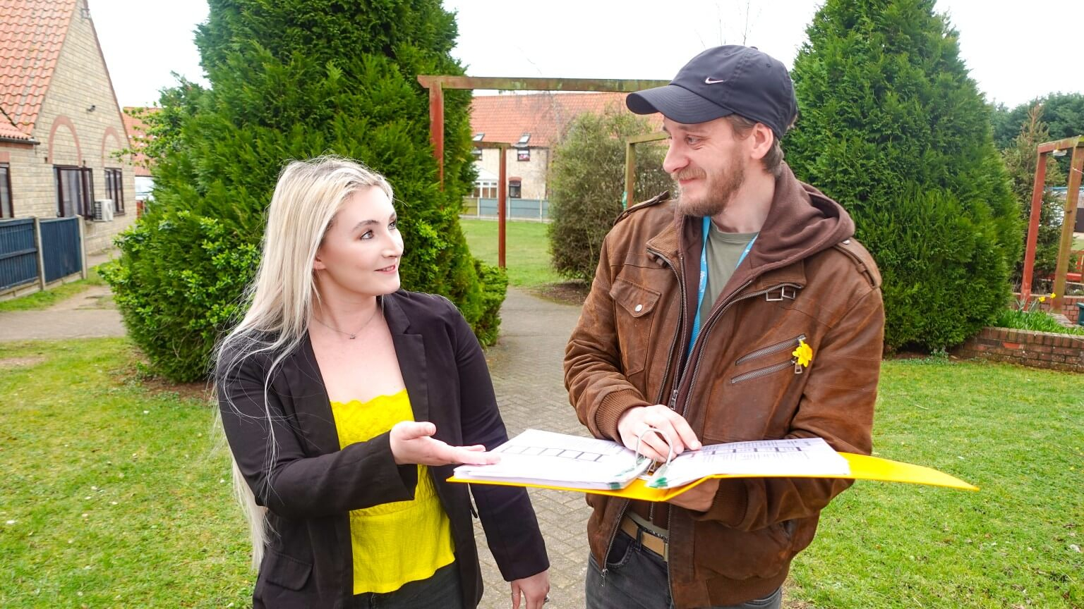 Deputy Manager and team member talking outside