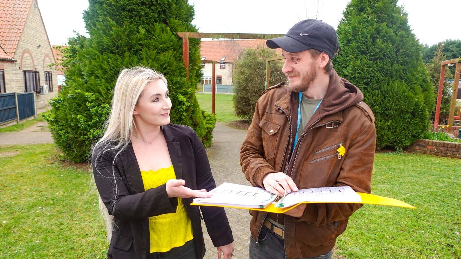 Deputy Manager and team member talking outside