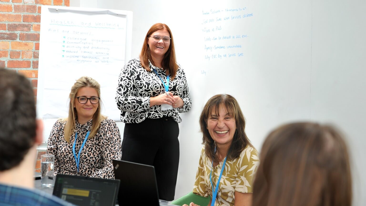 Team members smiling during a training session