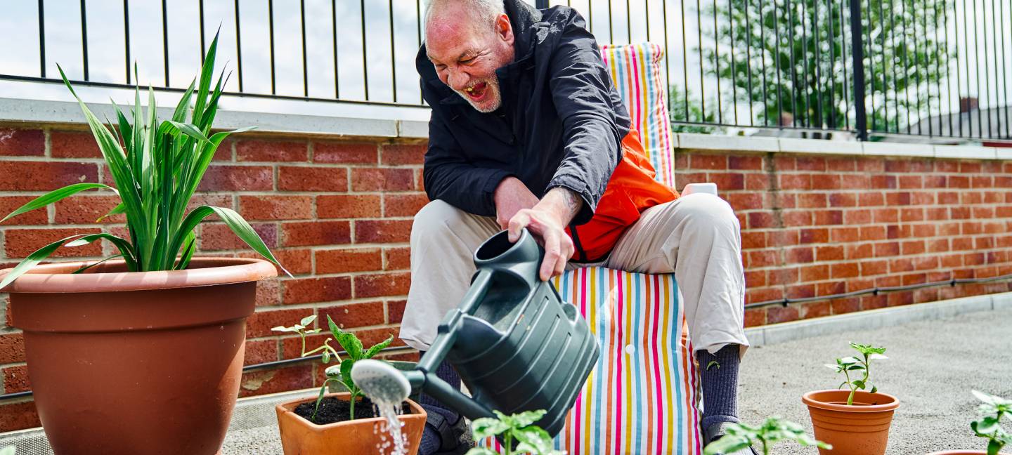 Man watering garden