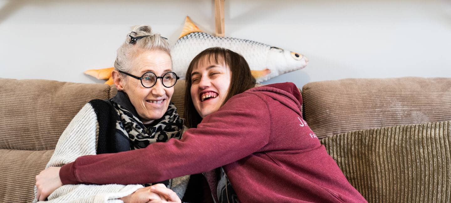 Daughter hugging mother