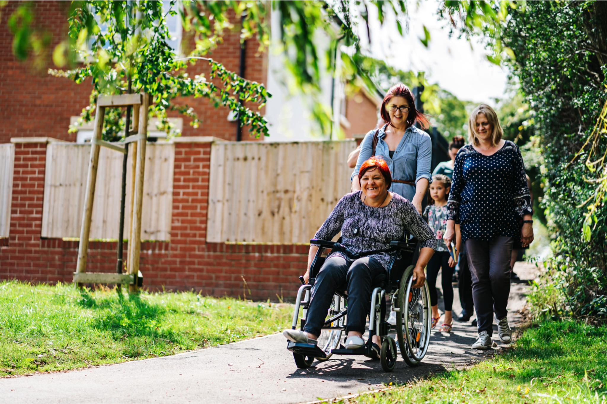 A person being pushed in a wheelchair