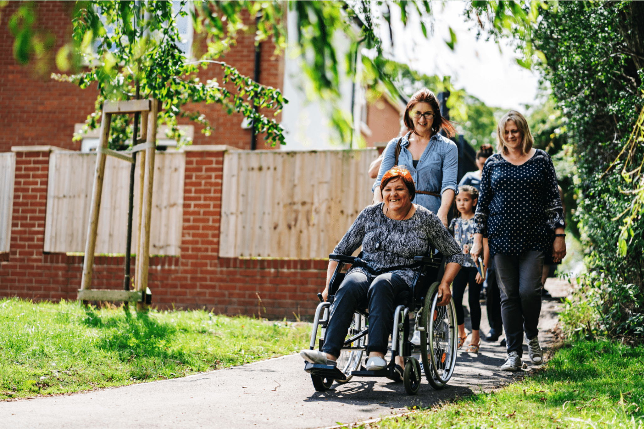 A person being pushed in a wheelchair