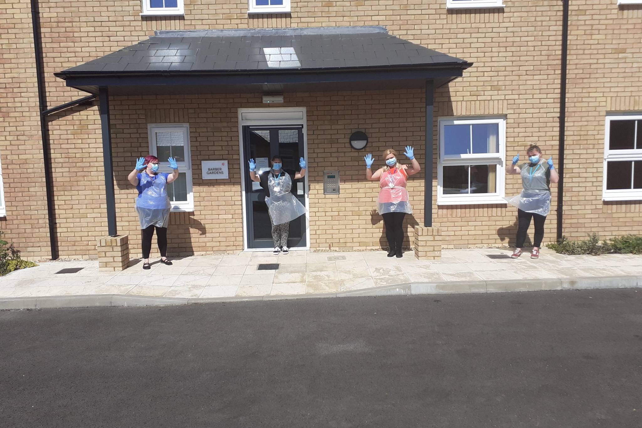 Staff outside the service wearing PPR