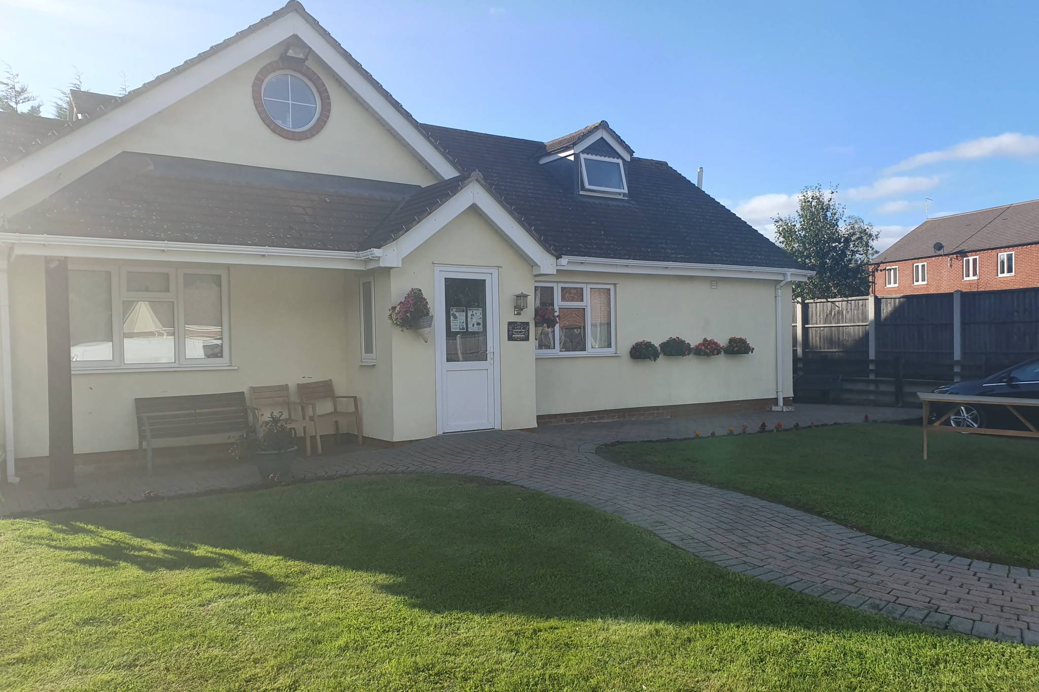 A picture of a house in the sunshine