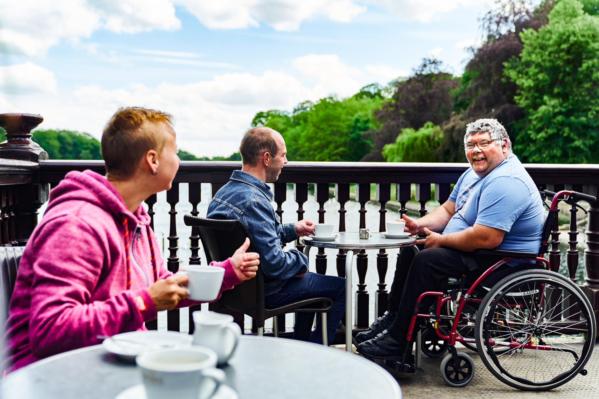 A group of people sat by a river