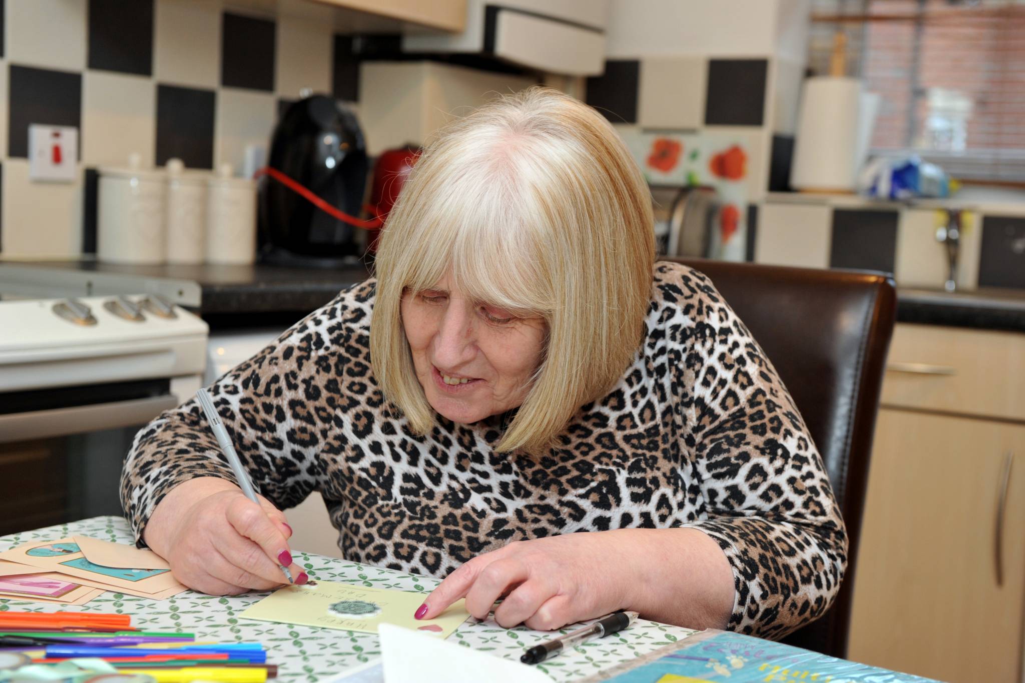 Person doing arts and crafts in a kitchen