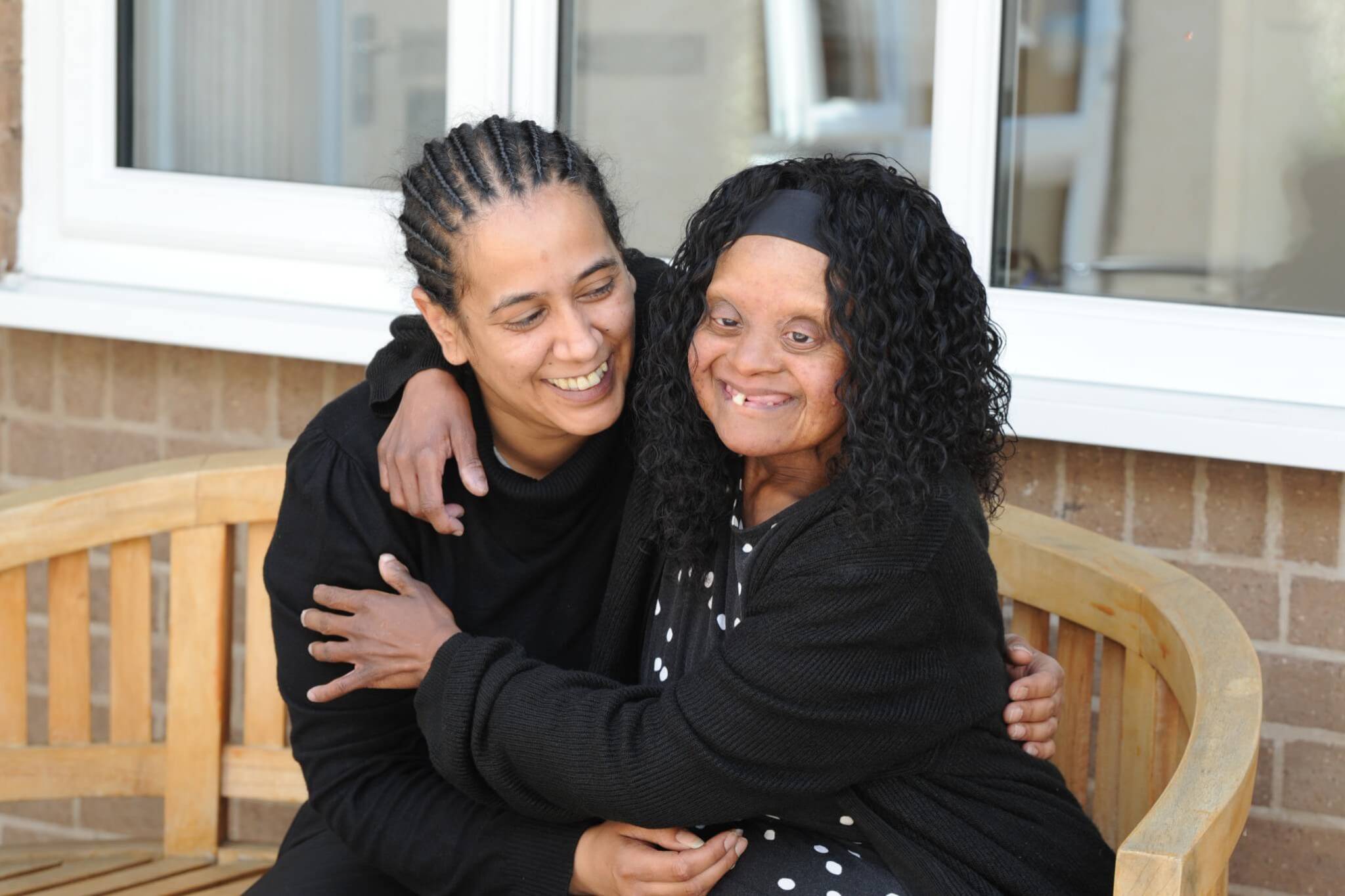 Person we support hugging service manager