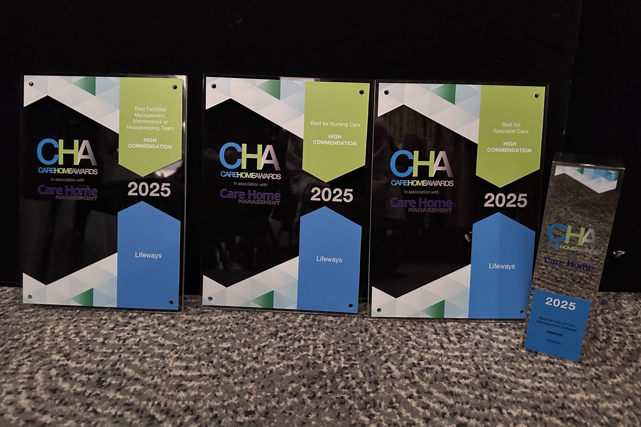A picture of four awards won by Lifeways at the Care Home Awards 2025