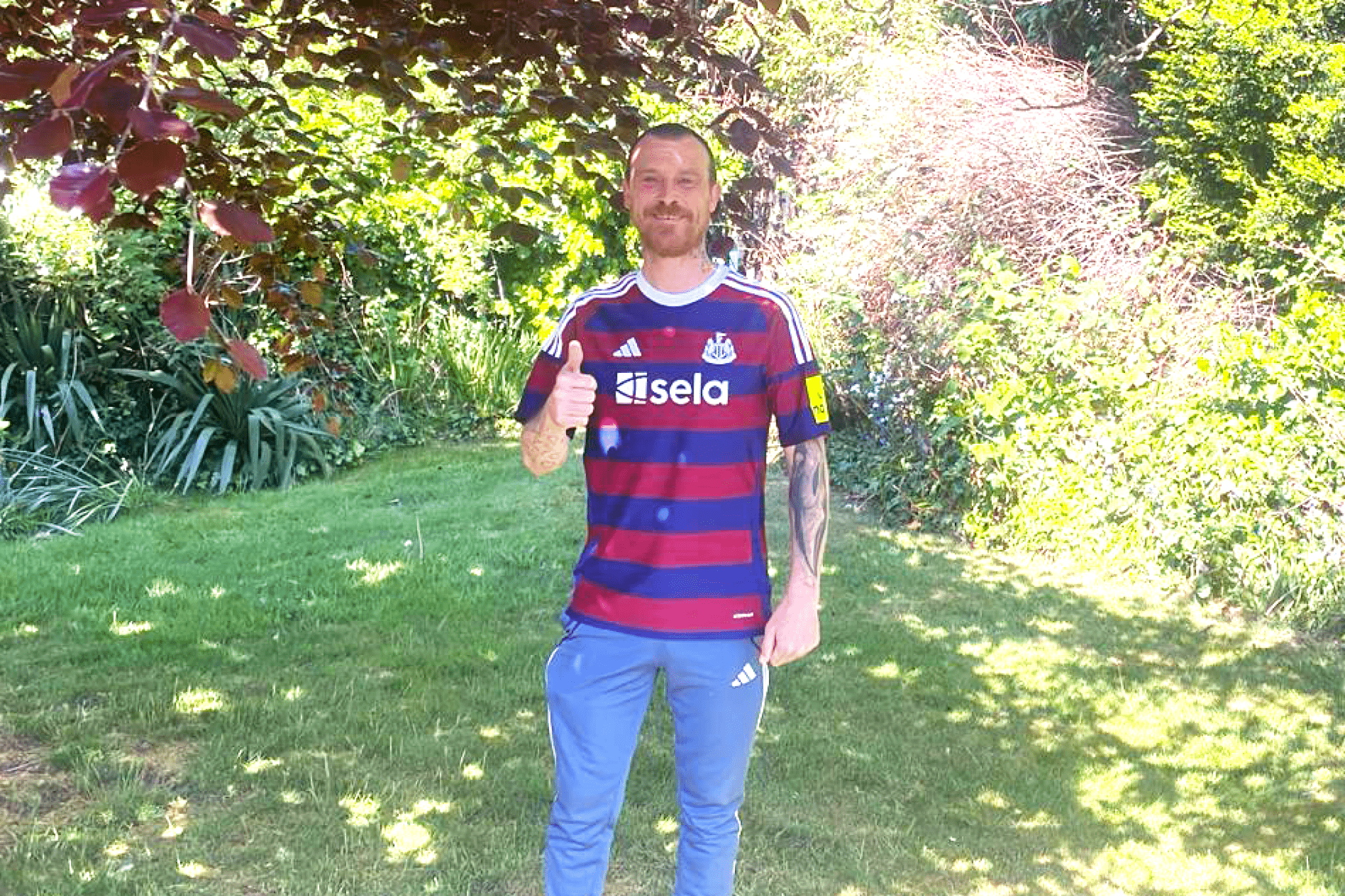 Support worker Nathan Rutherford in a garden