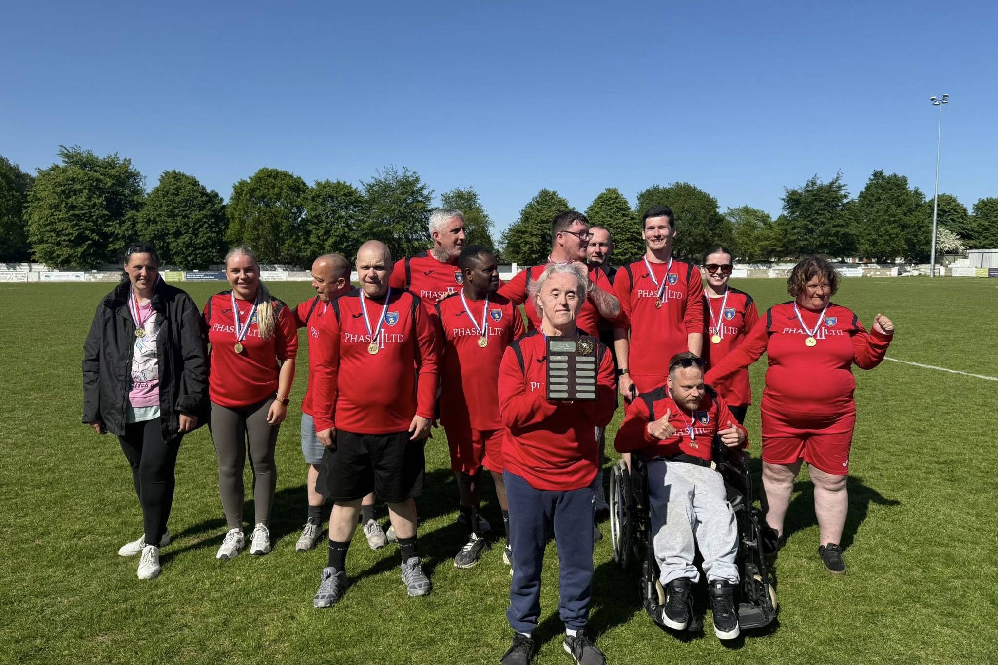 The winning team lifting the trophyat the Lifeways North East Supported Living football tournament
