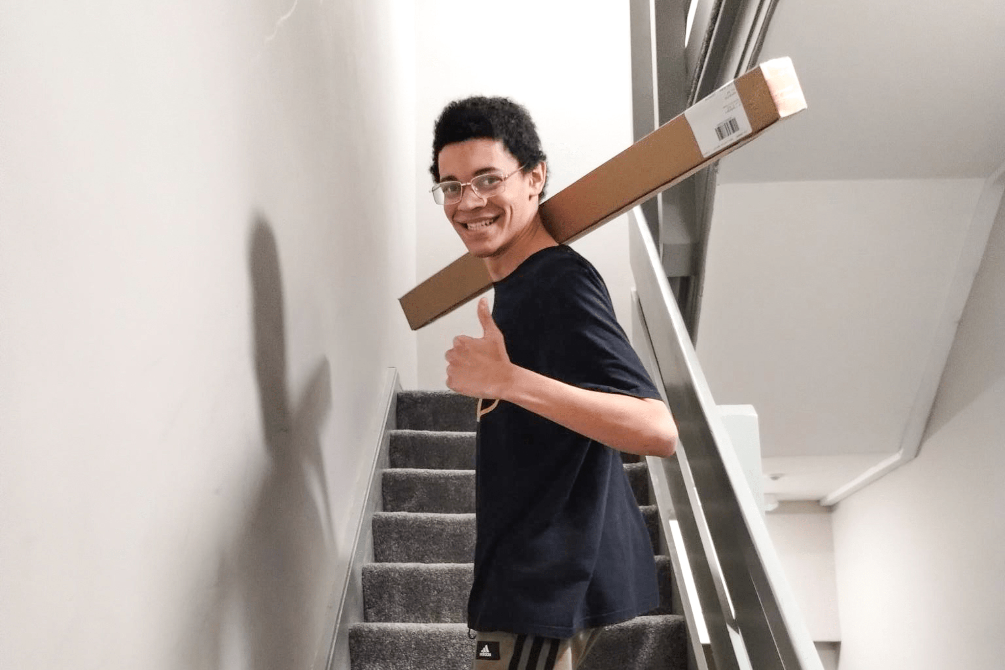 Someone supported by Lifeways in Manchester climbs stairs at the service as he creates his new home
