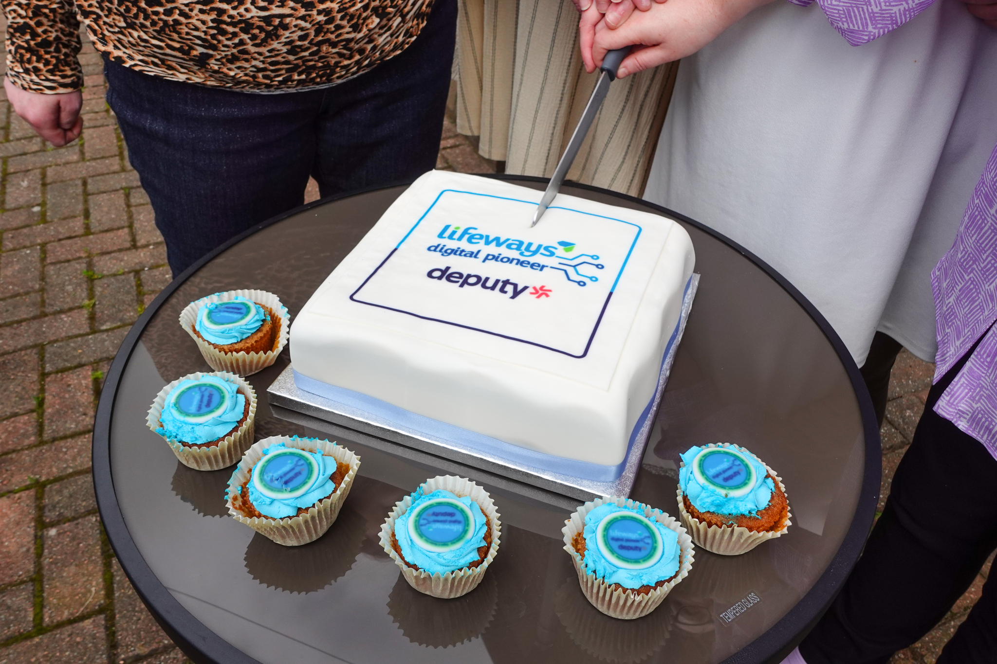 Lifeways and Deputy celebrated their partnership with a cake and a party at a service