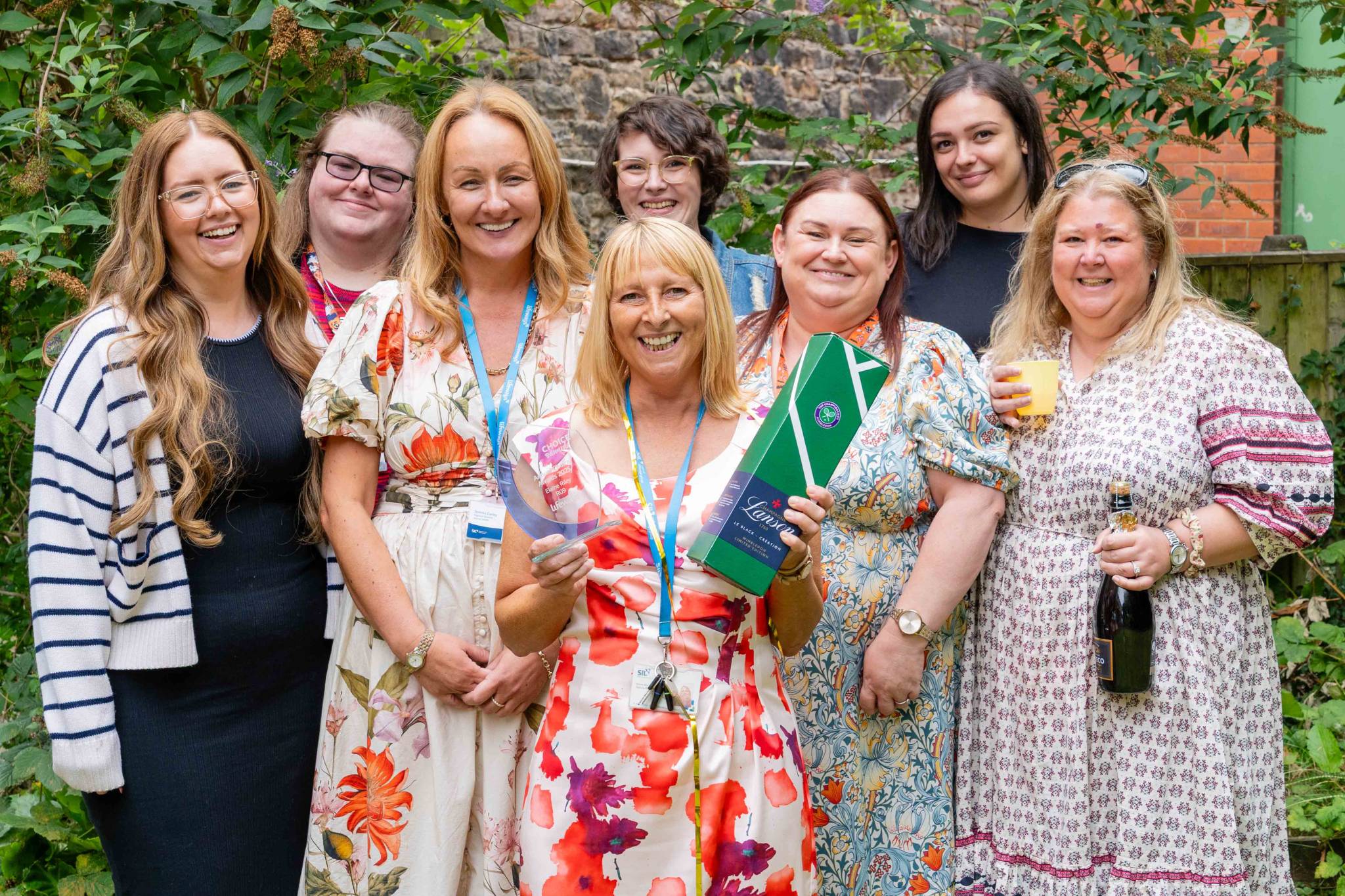A team of people celebrating an award win